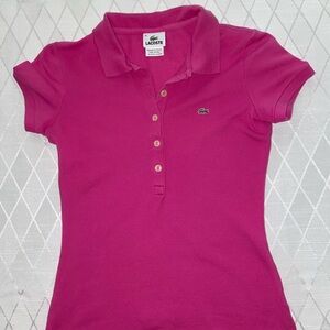 Women’s pink Lacoste polo shirt.